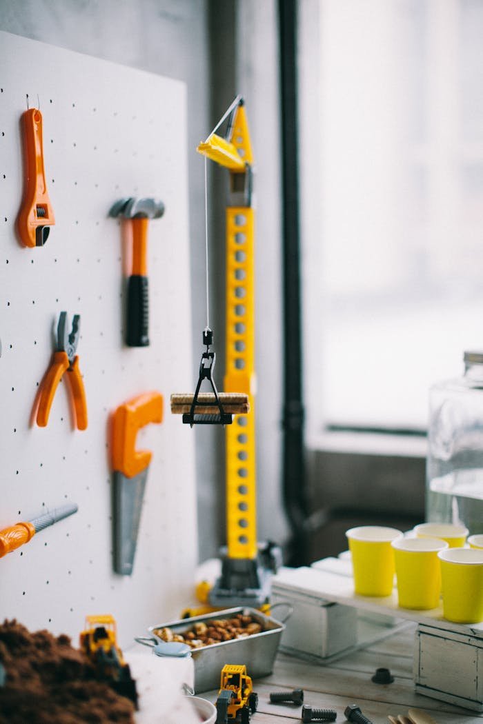 A vibrant setup showcasing tools on a pegboard with toy construction items, perfect for DIY themes.